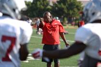 Wide receiver coach Cedric Cormier teaches receiver techniques during football practice at Rebel Park inside the UNLV campus in Las Vegas on Thursday, Aug. 25, 2016. (Martin S. Fuentes/Las Vegas R ...