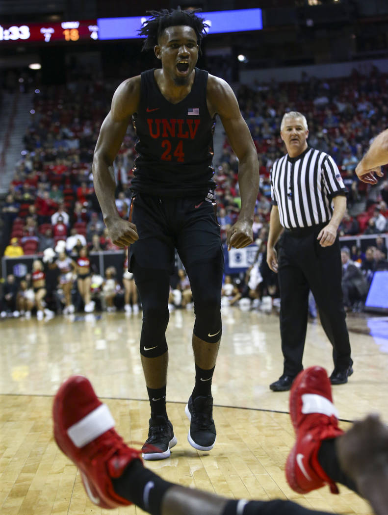 UNLV Rebels forward Joel Ntambwe (24) celebrates after a foul was called against San Diego State during the first half of a quarterfinal game in the Mountain West men's basketball tournament at th ...