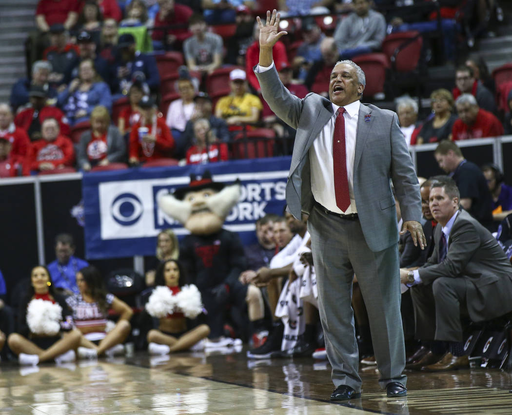 UNLV Rebels head coach Marvin Menzies reacts during the first half of a quarterfinal game against San Diego State in the Mountain West men's basketball tournament at the Thomas & Mack Center i ...