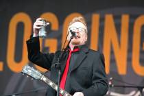 Dave King of Flogging Molly toasts the crowd at the Austin City Limits Music Festival in Austin, Texas on Saturday, Oct. 3, 2009. (AP Photo/Jack Plunkett)