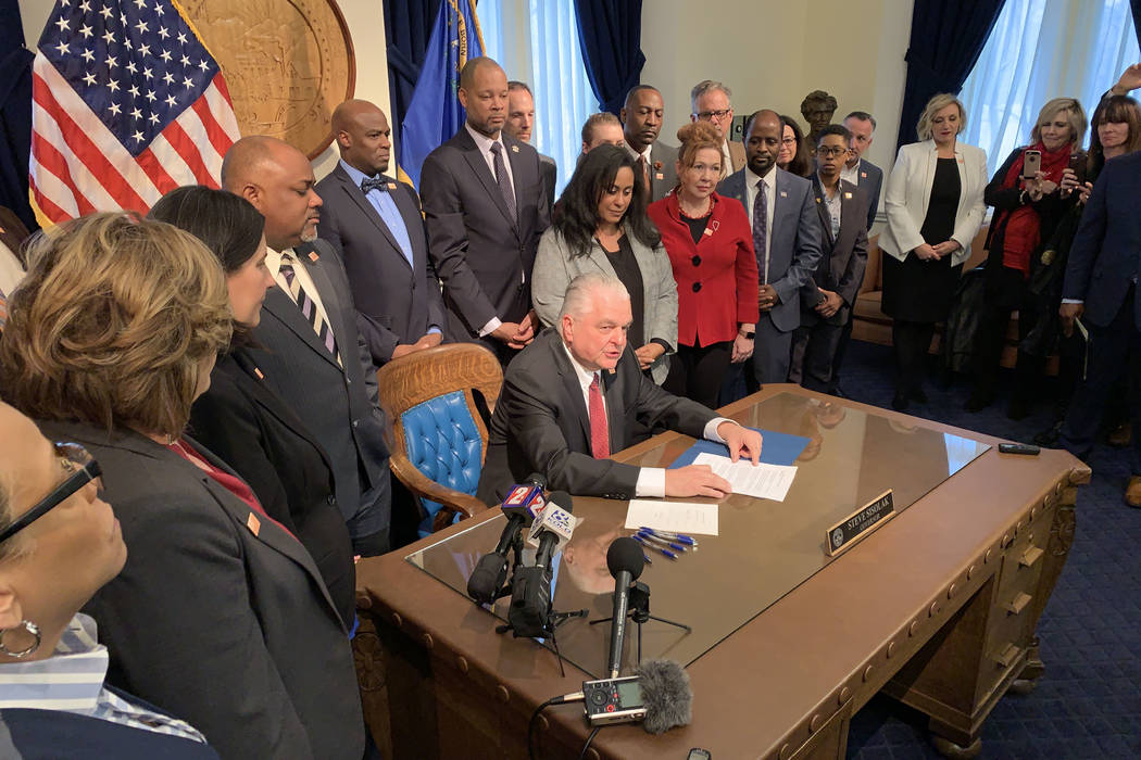 Gov. Steve Sisolak speaks as he signs Nevada's law requiring background checks on private gun sales, Friday, Feb. 15, 2019. The law will go into effect in January. (Bill Dentzer/Las Vegas Review-J ...