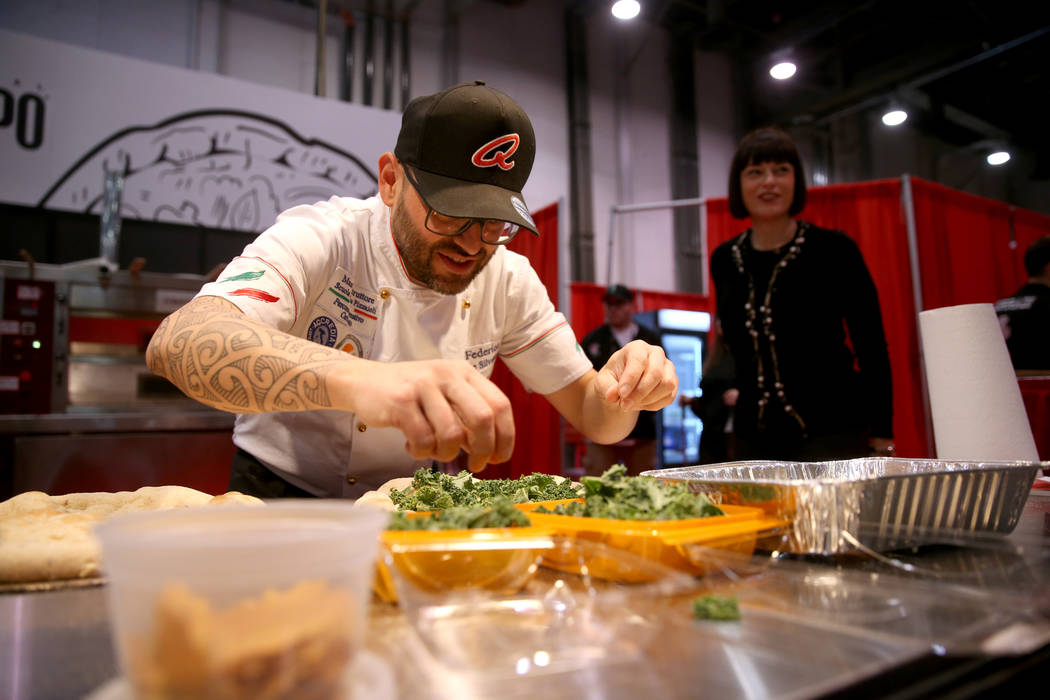 Federico De Silvestri of Verona, Italy, competes in the finals for the non-traditional pizza category during the International Pizza Challenge at the International Pizza Expo at the Las Vegas Conv ...