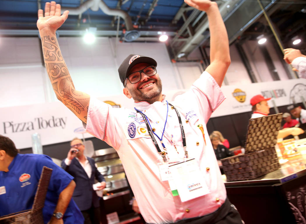 Federico De Silvestri of Verona, Italy, wins the finals for the non-traditional pizza category during the International Pizza Challenge at the International Pizza Expo at the Las Vegas Convention ...