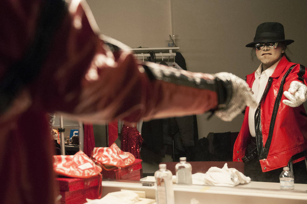 Sean E. Cooper gets ready before entertaining the crowd with his Michael Jackson impression during his show at Sin City Theatre inside Planet Hollywood hotel-casino in Las Vegas, Saturday, Dec. 7, ...