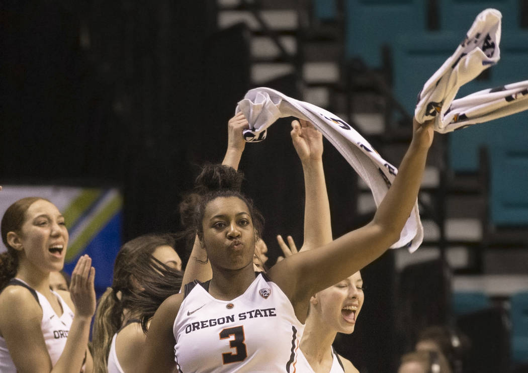Oregon State junior guard Madison Washington (3), a Las Vegas native and Bishop Gorman graduate, fires up the Beavers bench in the second quarter during their Pac 12 Tournament game with the Washi ...