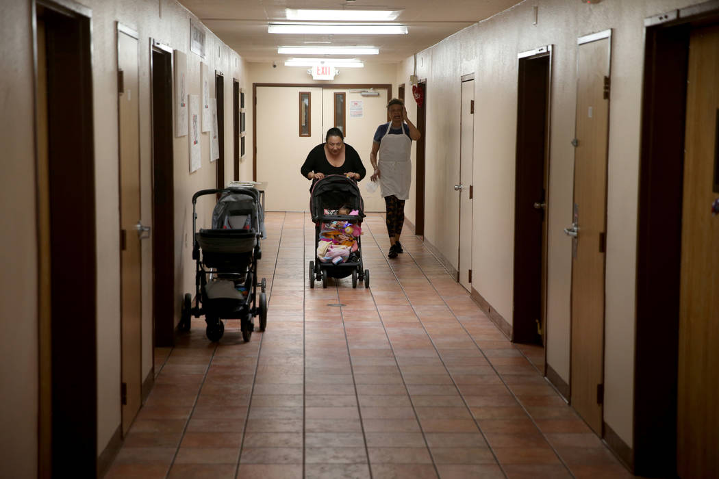 Carolina with her 1-year-old daughter, Jazmin, left, in a new transitional housing hallway, named the "Second Chance Wing" at WestCare Nevada Women and Children's Campus in Las Vegas, Wednesday, M ...