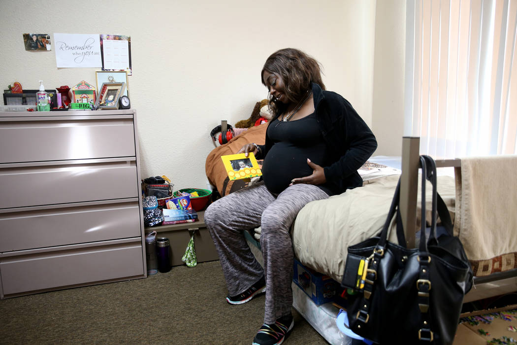 Annette Marie who is 24 weeks pregnant, with a photo of her other child in her bedroom in the new transitional housing area, named the "Second Chance Wing," at WestCare Nevada Women and Children's ...