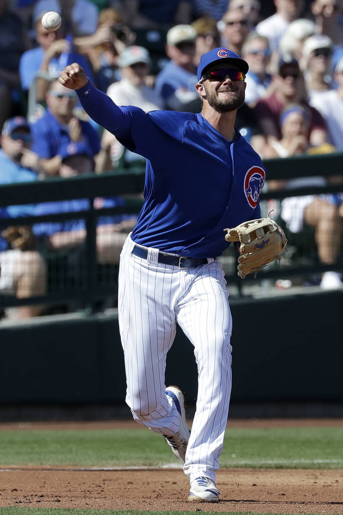Chicago Cubs third baseman Kris Bryant throws Oakland Athletics' Franklin Barreto out at first during the fourth inning of a spring baseball game in Mesa, Ariz., Thursday, Feb. 28, 2019. (AP Photo ...