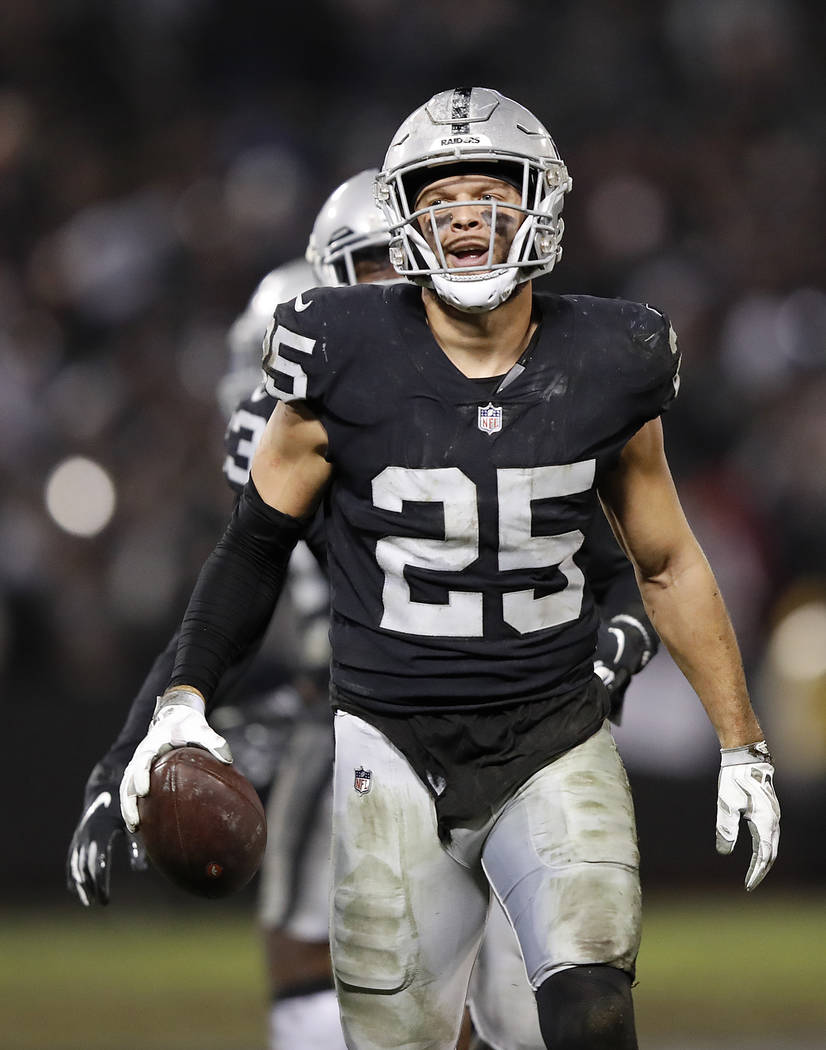 Oakland Raiders defensive back Erik Harris (25) holds onto the ball after intercepting a pass against the Denver Broncos during the second half of an NFL football game in Oakland, Calif., Monday, ...