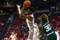 UNLV Rebels forward Joel Ntambwe (24) gets a rebound in front of Colorado State guard Kris Martin (30) during the second half of a basketball game at the Thomas & Mack Center in Las Vegas on W ...