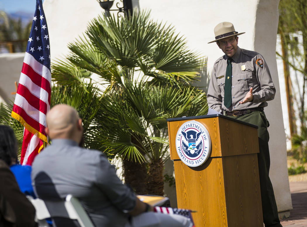 Mike Reynolds, superintendent of Death Valley National Park, speaks during a naturalization ceremony at the Mission Gardens at The Inn at Death Valley on Friday, March 8, 2019. (Chase Stevens/Las ...