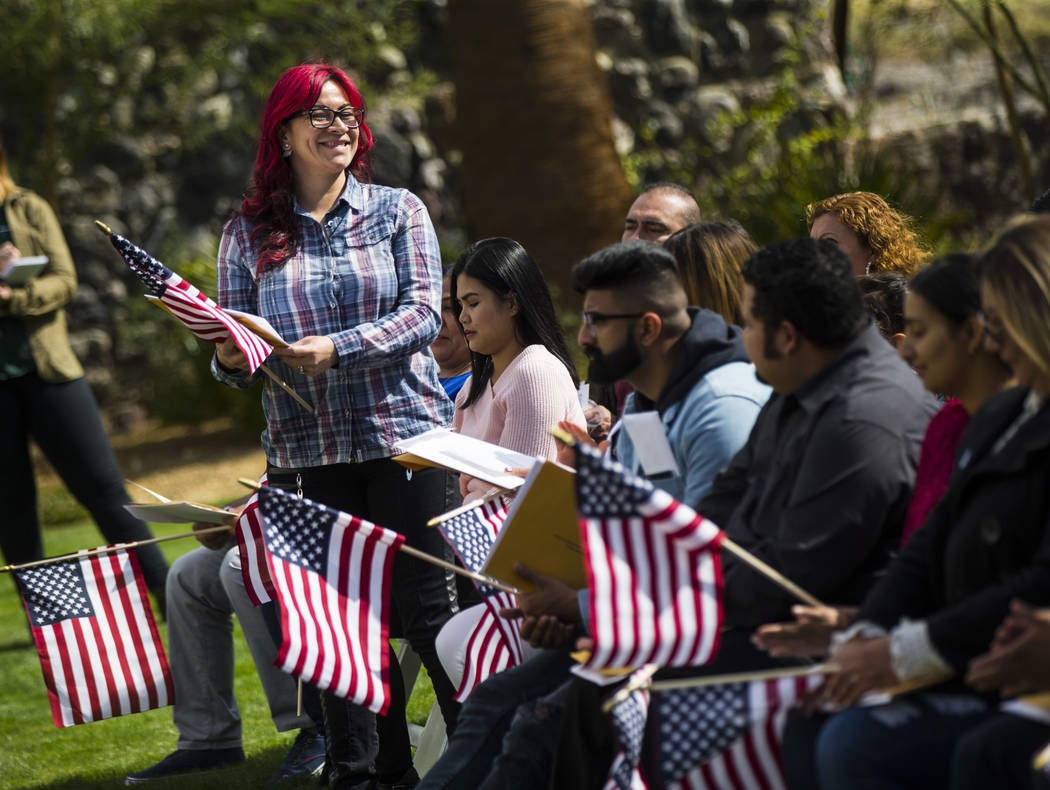 Duneya Van Zandt, who immigrated from Colombia and now lives in Calif., stands to be recognized during a naturalization ceremony at the Mission Gardens at The Inn at Death Valley in Death Valley N ...
