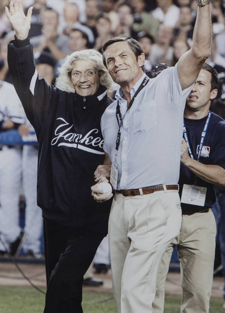 A photo of Julia Ruth Stevens, left, the daughter of New York Yankee Hall of Fame slugger Babe Ruth, and son Tom Stevens waving to fans before Ruth Stevens threw out the first pitch at the last ga ...