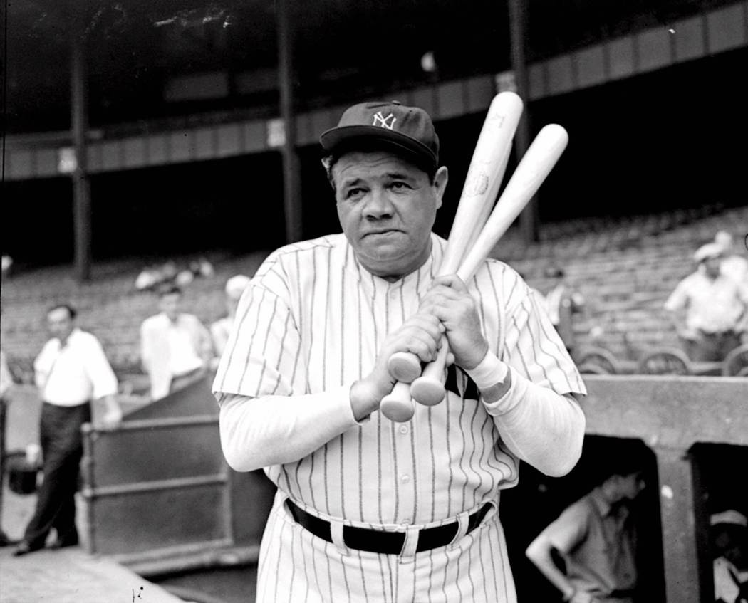 FILE -- Retired Yankees slugger Babe Ruth warms up with three bats before stepping to the plate at New York's Yankee Stadium, August 21, 1942, as he prepared for a hitting exhibition. Before Pedro ...