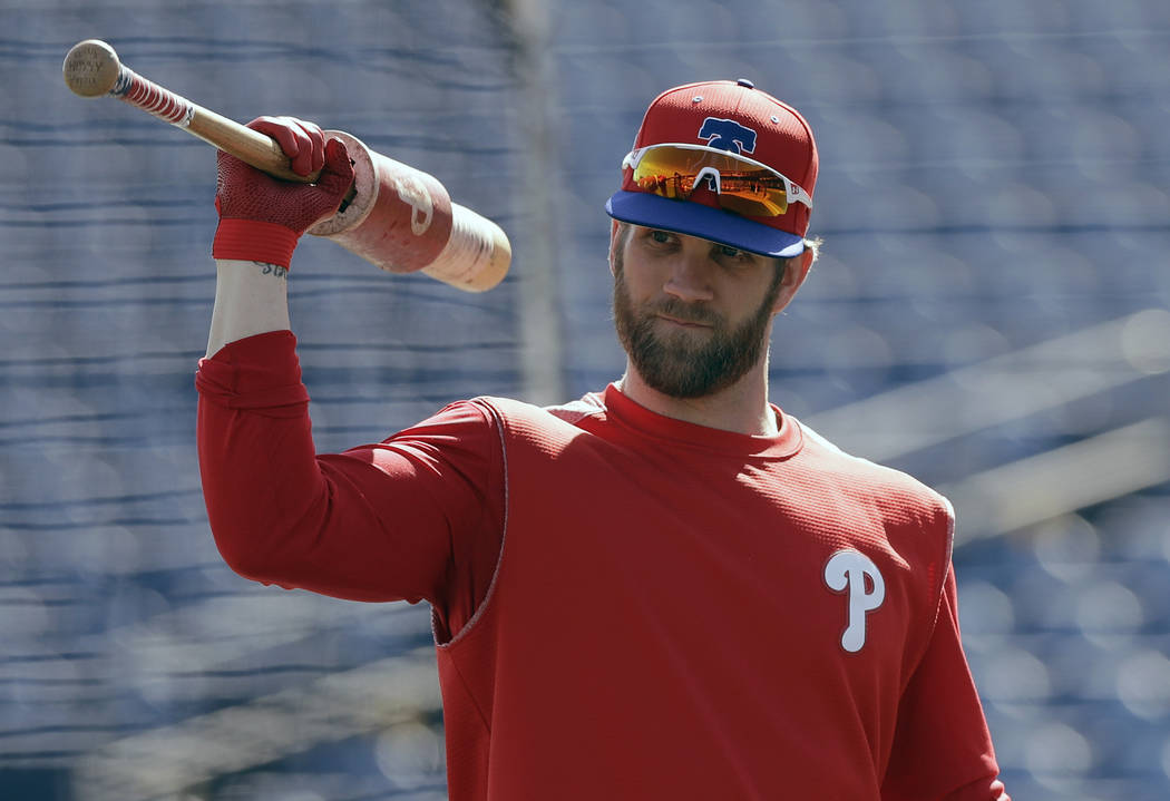 Philadelphia Phillies' Bryce Harper waits his turn in the batting cage before a spring training baseball game against the Toronto Blue Jays Saturday, March 9, 2019, in Clearwater, Fla. (AP Photo/C ...
