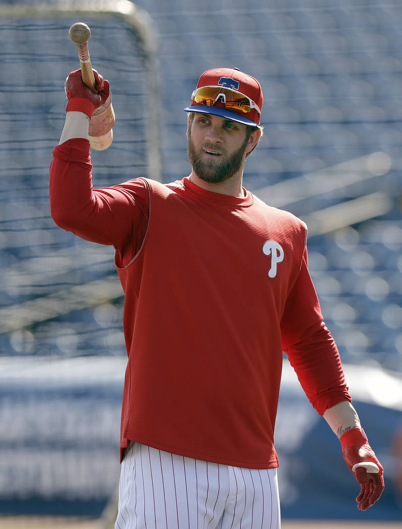 Philadelphia Phillies' Bryce Harper waits his turn in the batting cage before a spring training baseball game against the Toronto Blue Jays Saturday, March 9, 2019, in Clearwater, Fla. (AP Photo/C ...