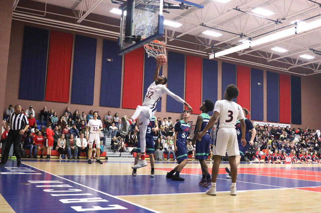 Darren Jones (52) dunks the basketball during a game against SLAM Academy at American Preparatory Academy in Las Vegas, Thursday, Jan. 17, 2019. (Heidi Fang /Las Vegas Review-Journal) @HeidiFang