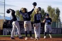 Centennial playes Sam Simon (16), Kris Bow (42) and Rene Almarez (22) greet teammate Austin Kryszczuk after his two-run home run in the second inning against Arbor View on Saturday, March 9, 2019 ...