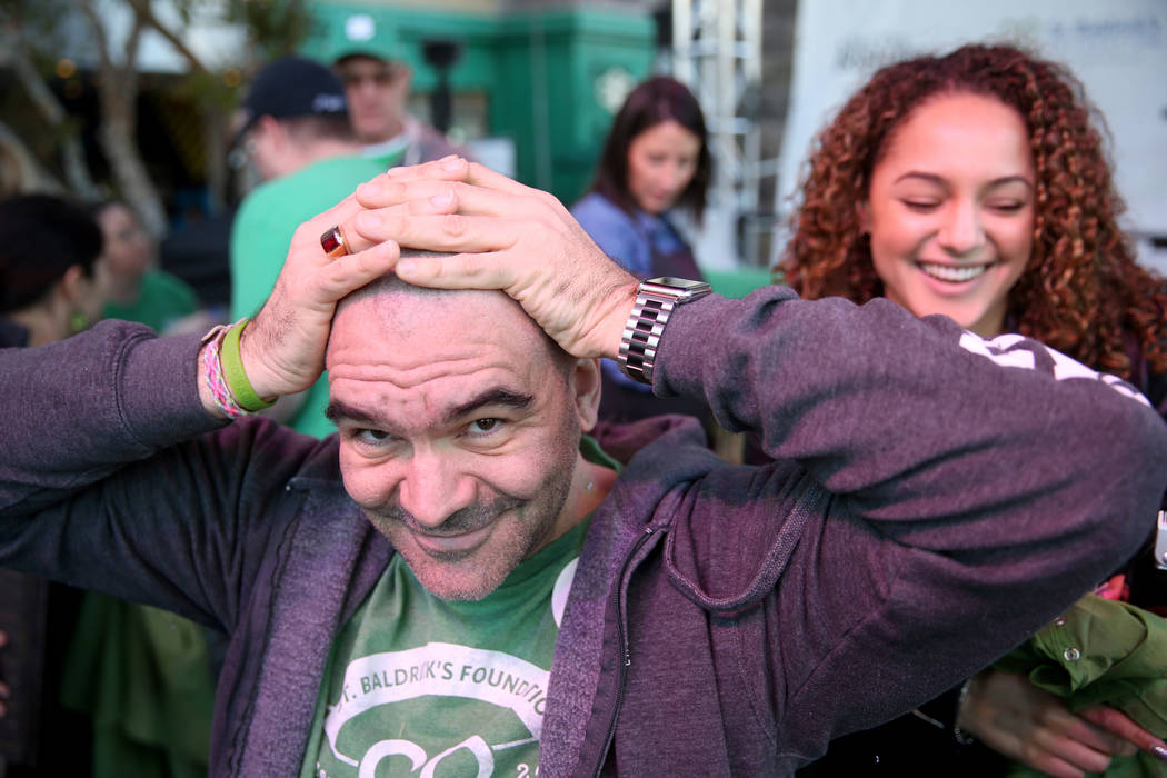 Las Vegas Review-Journal man-about-town columnist John Katsilometes after getting his head shaved by Brianna Brown during St. Baldrick's Foundation shave-a-thon on the Brooklyn Bridge at New York- ...