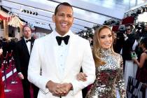 Alex Rodriguez, left, and Jennifer Lopez arrive at the Oscars at the Dolby Theatre in Los Angeles in February 2019. (Photo by Charles Sykes/Invision/AP)