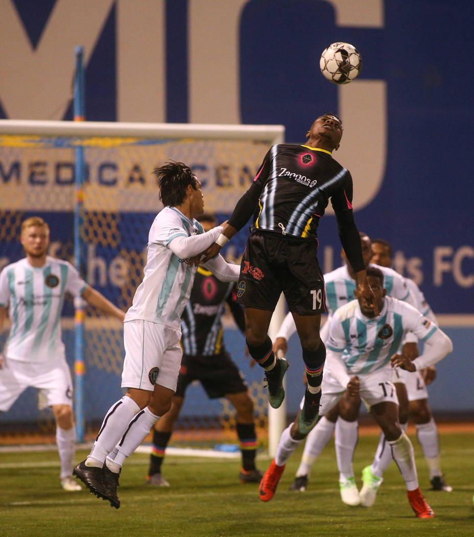 Las Vegas Lights FC forward Tabort Etaka Preston (19) jumps up to head the ball during the second half of a United Soccer League match at Cashman Field in Las Vegas, Saturday, March 9, 2019. (Caro ...