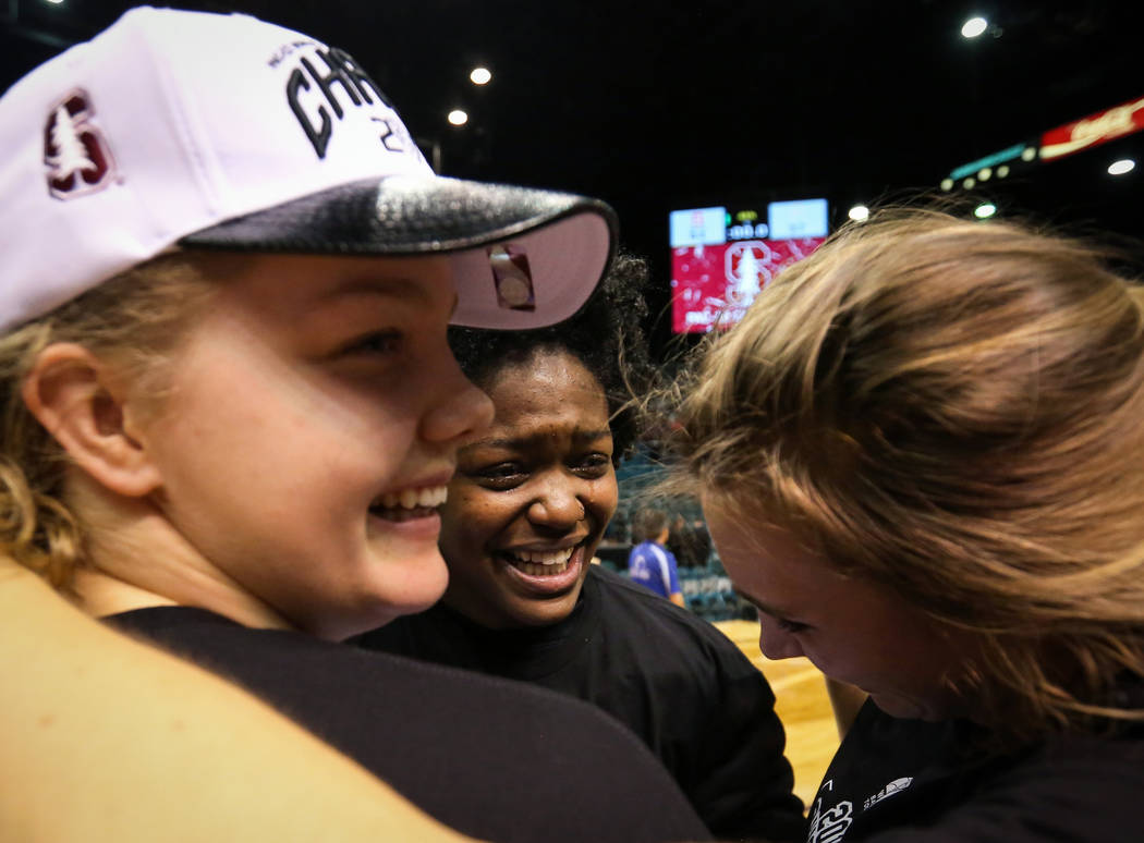 Stanford Cardinal forward Alyssa Jerome (10), Stanford Cardinal forward Nadia Fingall (4) and Stanford Cardinal forward Estella Moschkau (20) hug while celebrating after defeating the Oregon Ducks ...