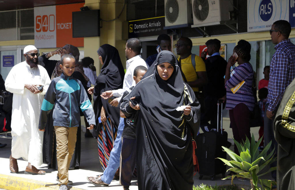 Relatives of the victims involved in a plane crash wait for information at Jomo Kenyatta International Airport, Nairobi, Kenya, Sunday, March 10, 2019. An Ethiopian Airlines flight crashed shortly ...