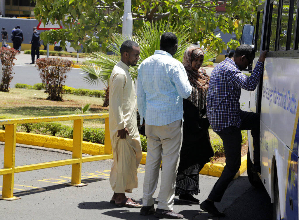 Relatives of the victims involved in a plane crash board a bus at Jomo Kenyatta International Airport, Nairobi, Kenya, Sunday, March 10, 2019, to travel to a hotel to receive more information. An ...