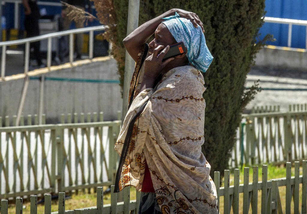 A family member of a victim involved in a plane crash talks on a mobile phone at Addis Ababa international airport Sunday, March 10, 2019. An Ethiopian Airlines flight crashed shortly after takeof ...