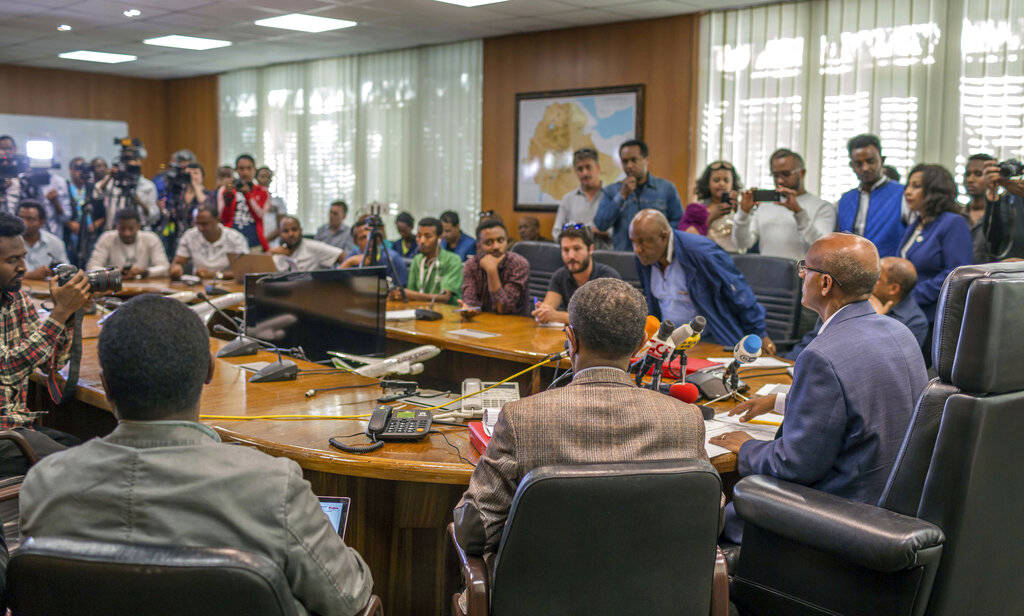 Ethiopian Airlines CEO Tewolde Gebremariam, seated right, holds a press briefing at the headquarters of Ethiopian Airlines in Addis Ababa, Ethiopia, Sunday, March 10, 2019. An Ethiopian Airlines f ...