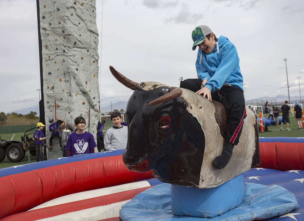 Avrohom Moshe Attal, 13, rides a mechanical bull during Friendship Circle's Walk4Friendship Las Vegas event at Las Vegas Sports Park, Sunday, March 10, 2019. Friendship Circle ...