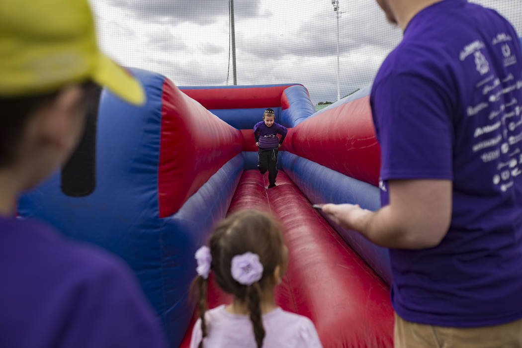 Yossi Chanya Goldblatt, 9, runs in a bouncy ride during Friendship Circle's Walk4Friendship Las Vegas event at Las Vegas Sports Park, Sunday, March 10, 2019. Friendship Circle ...