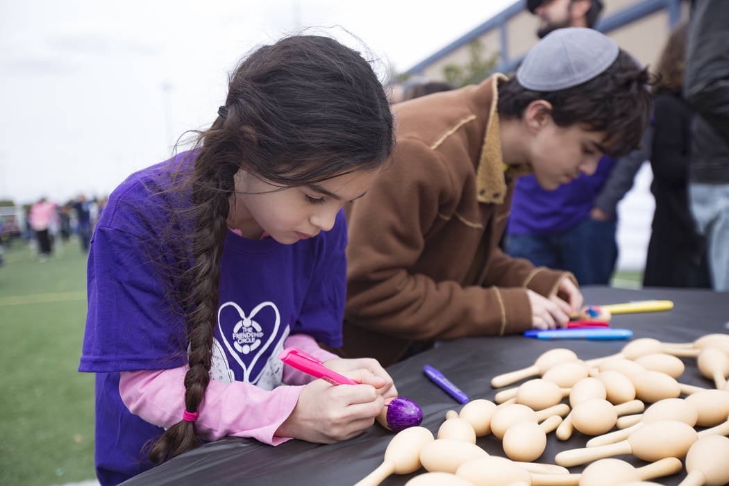Emma Kellman, 10, colors maracas with her brother Aaron Kellman, 10, at Las Vegas Sports Park as part of Friendship Circle's Walk for Friendship event in Las Vegas, Sunday, March 10, 2019. Friends ...