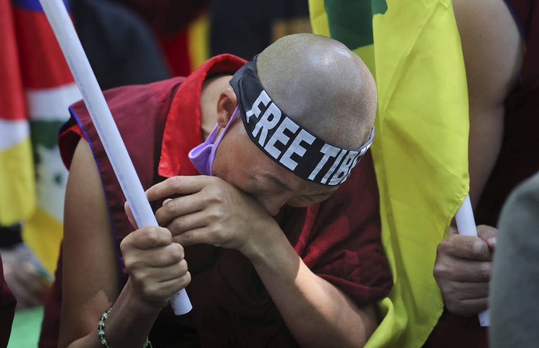 An exile Tibetan breaks down during a march to mark the 60th anniversary of the March 10, 1959 Tibetan Uprising Day, in New Delhi, India, Sunday, March 10, 2019. The uprising of the Tibetan people ...