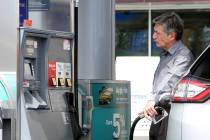 A customer pumps gas at Chevron gas station at the intersection of Tropical Avenue and Fort Apache Road in Las Vegas in this file photo. (Bizuayehu Tesfaye/Las Vegas Review-Journal) @bizutesfaye