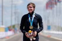United States gold medalist Kelly Catlin poses after winning the women's individual time trial cycling competition at the Pan Am Games in Milton, Ontario, in 2015. (AP Photo/Felipe Dana)
