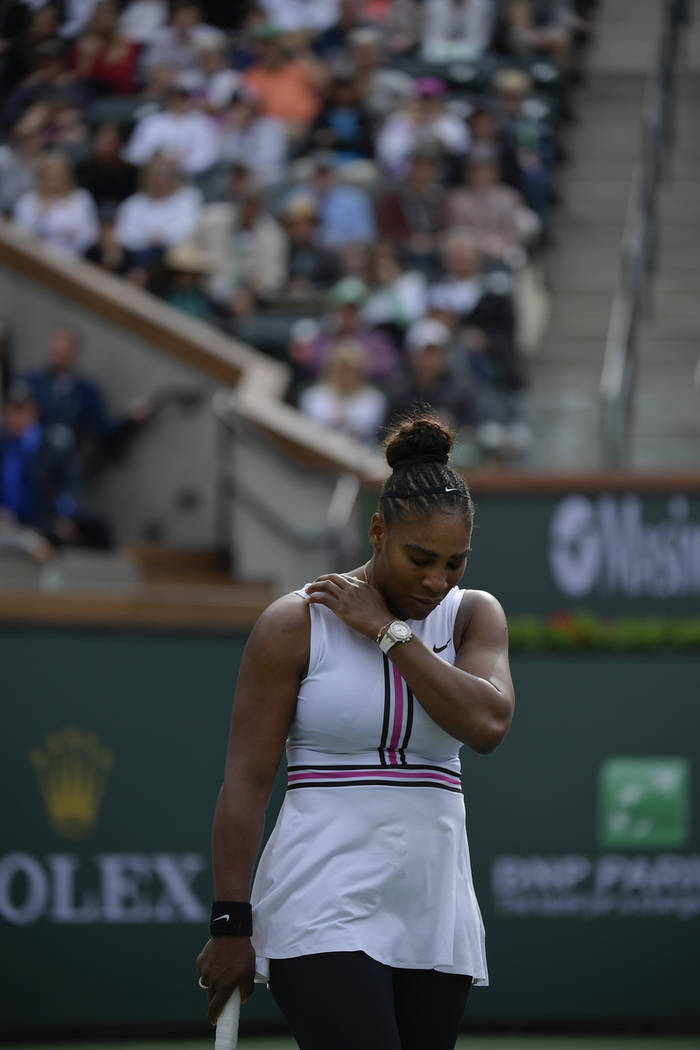 Serena Williams reacts during a match against Garbine Muguruza, of Spain, at the BNP Paribas Open tennis tournament Sunday, March 10, 2019, in Indian Wells, Calif. Williams retired from the match ...