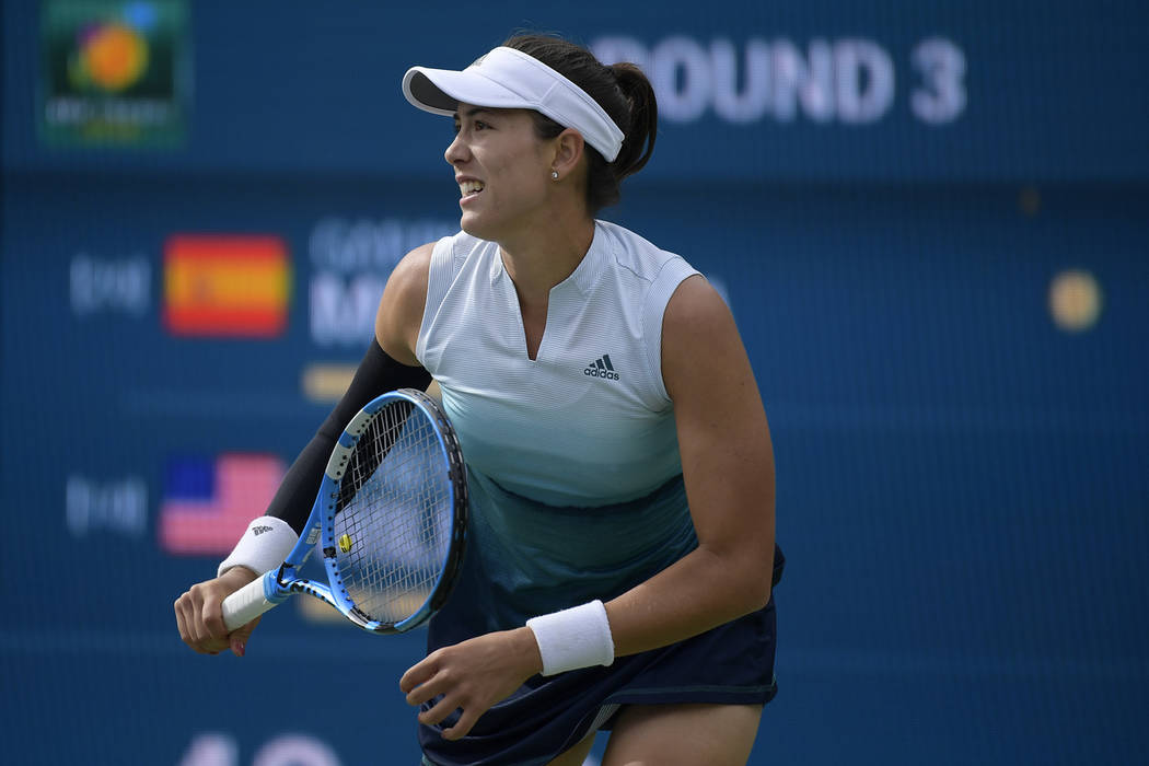 Garbine Muguruza, of Spain, waits to return to Serena Williams at the BNP Paribas Open tennis tournament Sunday, March 10, 2019, in Indian Wells, Calif. (AP Photo/Mark J. Terrill)