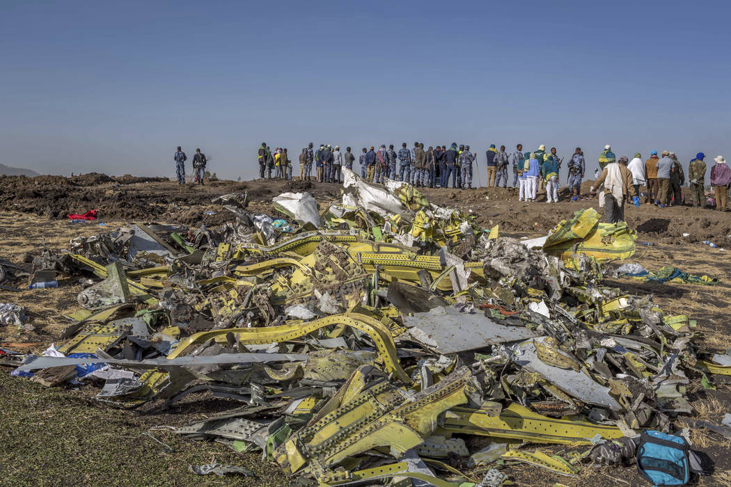 Wreckage is piled at the crash scene of an Ethiopian Airlines flight crash near Bishoftu, or Debre Zeit, south of Addis Ababa, Ethiopia, Monday, March 11, 2019. A spokesman says Ethiopian Airline ...