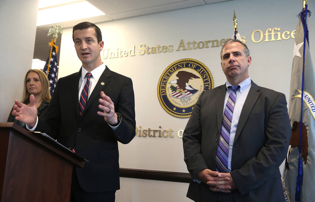 U.S. attorney Nicholas Trutanich, flanked by IRS Special Agent in Charge Tara Sullivan and FBI Assistant Special Agent in Charge Ray Johnson, during a news conference at the Federal Justice Tower ...
