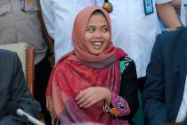 Indonesian Siti Aisyah smiles during a press conference upon returning home from Malaysia at Halim Perdanakusumah Airport in Jakarta, Indonesia, Monday, March 11, 2019. The Indonesian woman held t ...