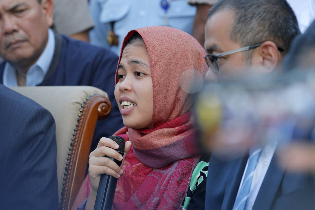 Indonesian Siti Aisyah, center, speaks during a press conference upon returning home at Halim Perdanakusumah Airport in Jakarta, Indonesia, Monday, March 11, 2019. The Indonesian woman held two ye ...