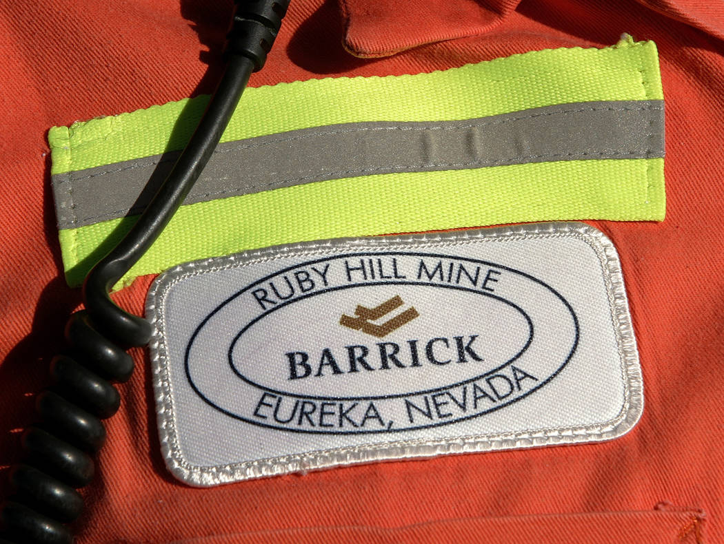 A close-up of the chest patch of a worker at Barrick's Ruby Hill Mine, outside Eureka. Barrick Gold is dropping its takeover bid for Newmont Mining, as the gold companies instead form a joint vent ...