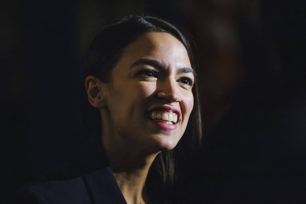 Rep. Alexandria Ocasio-Cortez, D-N.Y., delivers her inaugural address following her swearing-in ceremony at the Renaissance School for Musical Theater and Technology in the Bronx borough of New Yo ...