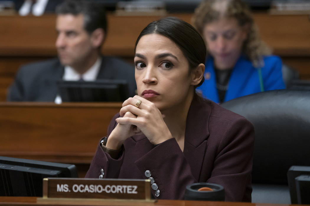 In this Feb. 27, 2019, photo, Rep. Alexandria Ocasio-Cortez, D-N.Y., listens to questioning of Michael Cohen on Capitol Hill in Washington. (AP Photo/J. Scott Applewhite)