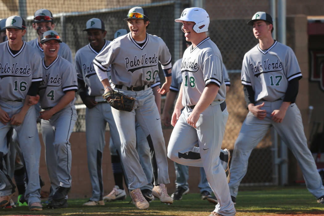 Palo Verde's Hunter Chynoweth (18), center, runs home for a run after hitting a homer against Desert Oasis in the baseball game at Desert Oasis High School in Las Vegas, Tuesday, March 12, 2019. E ...