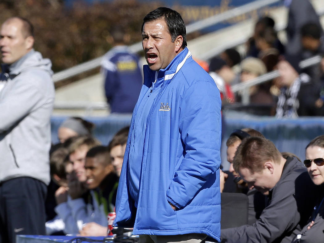 UCLA coach Jorge Salcedo reacts during the first half of an NCAA College Cup championship soccer game against Virginia in Cary, N.C., Dec. 14, 2014. Salcedo was charged along with nearly 50 other ...