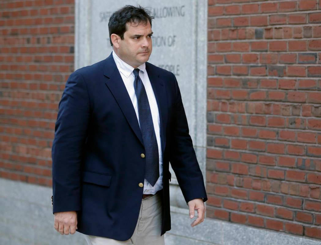 John Vandemoer, former head sailing coach at Stanford, arrives at federal court in Boston on Tuesday, March 12, 2019, where he was expected to plead guilty to charges in a nationwide college admis ...