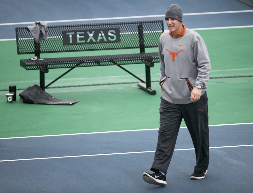 Texas men’s tennis coach Michael Center surveys the courts before the matches with UTSA, in Austin, Texas, January 2018. Center is among a few people in the state charged in a scheme that invol ...