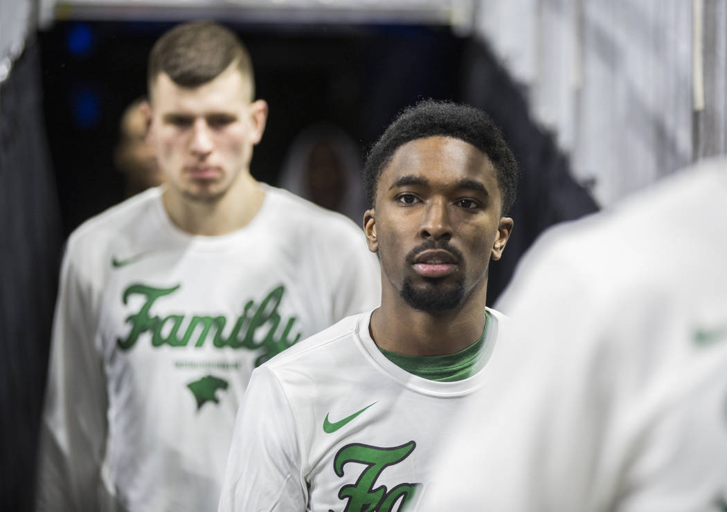 Chicago State sophomore guard Travon Bell, middle, walks out of the tunnel before the start of the Cougars opening round Western Athletic Conference tournament game with New Mexico State on Thursd ...